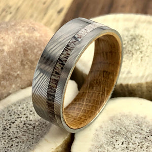 316/304 Stainless Damascus Steel Ring with Deer Antler Inlay and Tennessee Whiskey Barrel Sleeve